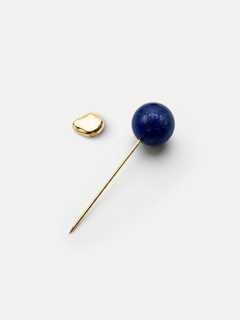 Veronica Beard Gold lapel pin with blue lapis lazuli sphere.