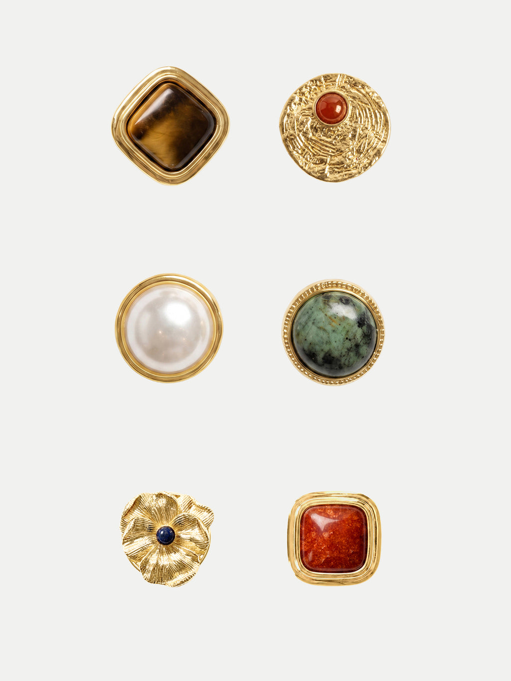 Veronica Beard Six gold decorative buttons with various colored stones.