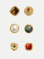 Veronica Beard Six gold decorative buttons with various colored stones.