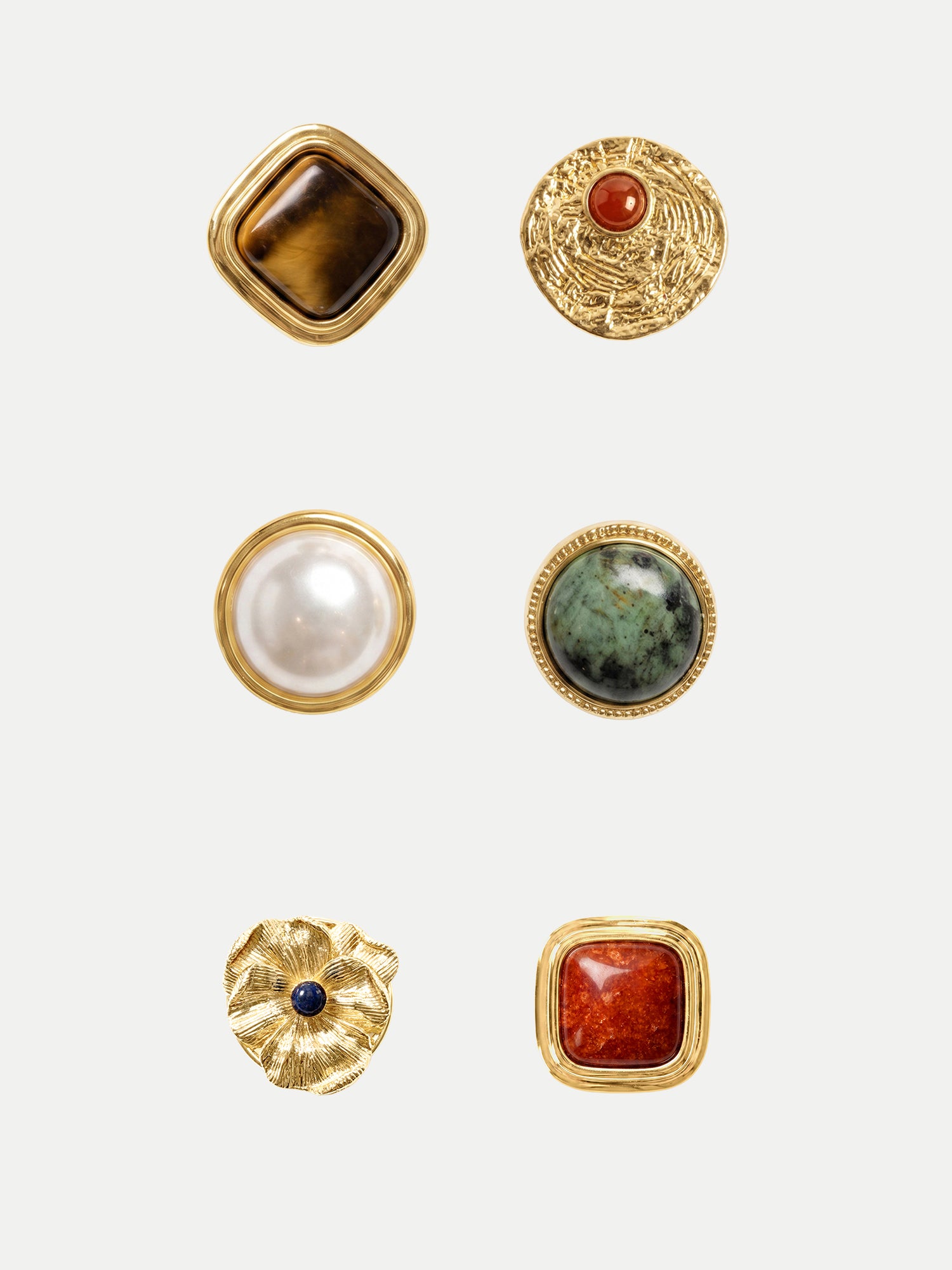 Veronica Beard Six gold decorative buttons with various colored stones.