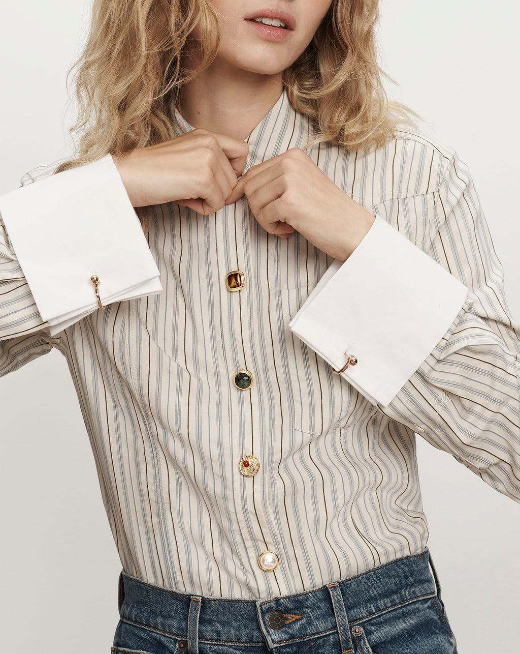 Veronica Beard Striped beige button-down shirt with oversized white cuffs.