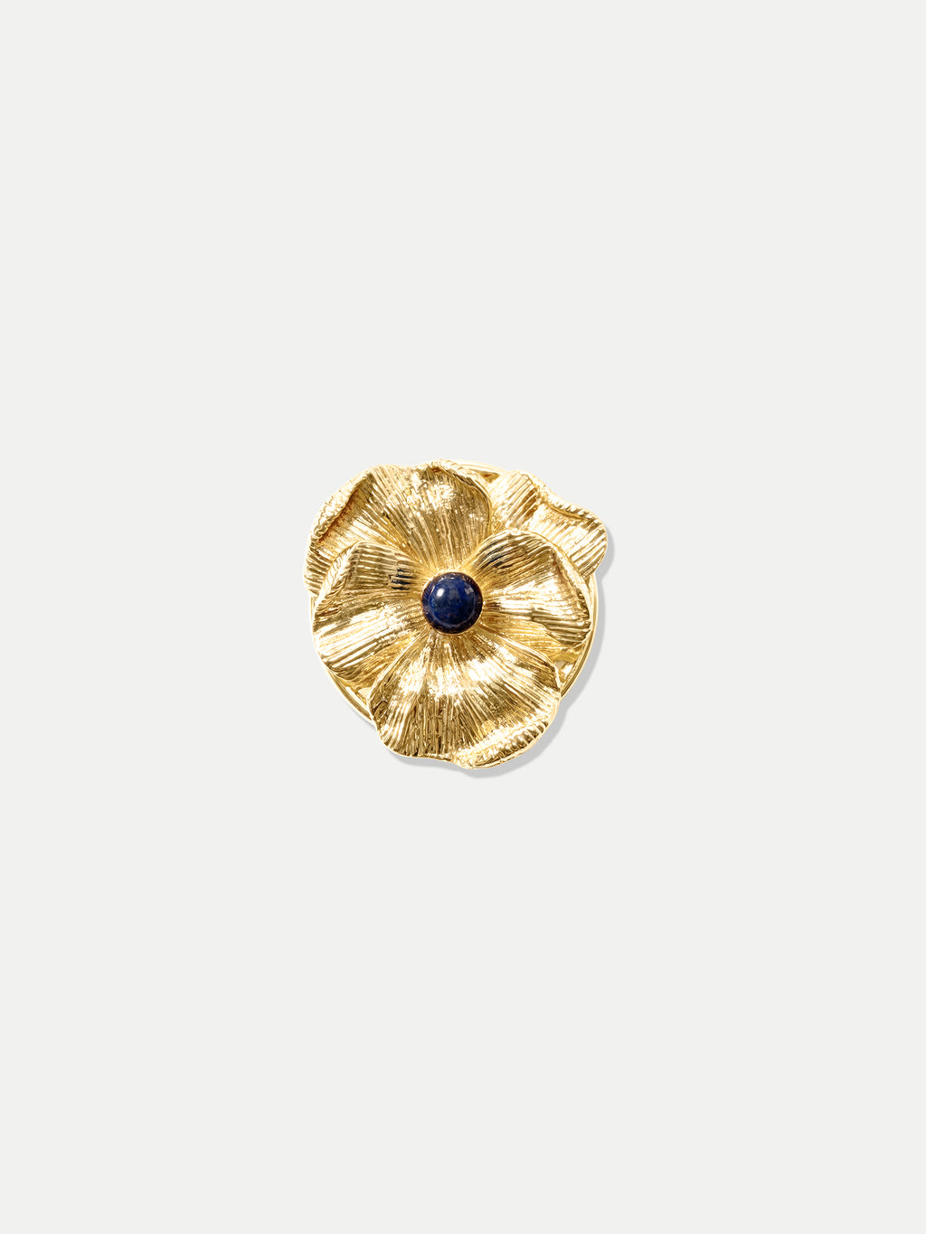 Veronica Beard Textured gold flower ring with blue center stone.
