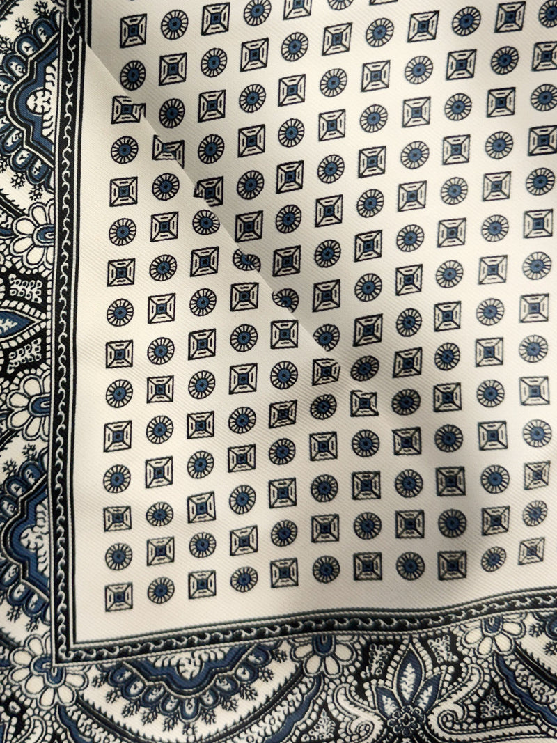 Veronica Beard White silk scarf with blue geometric and paisley patterns.
