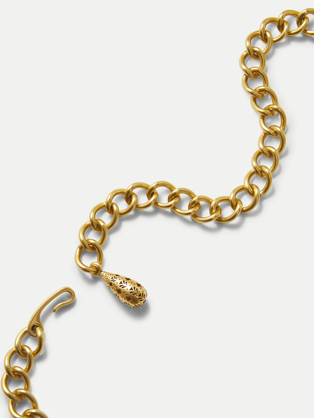Veronica Beard Gold chain necklace with ornate teardrop charm.