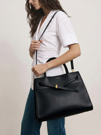 Veronica Beard Black leather tote bag with gold hardware.
