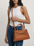 Veronica Beard Brown leather satchel with a bow detail.