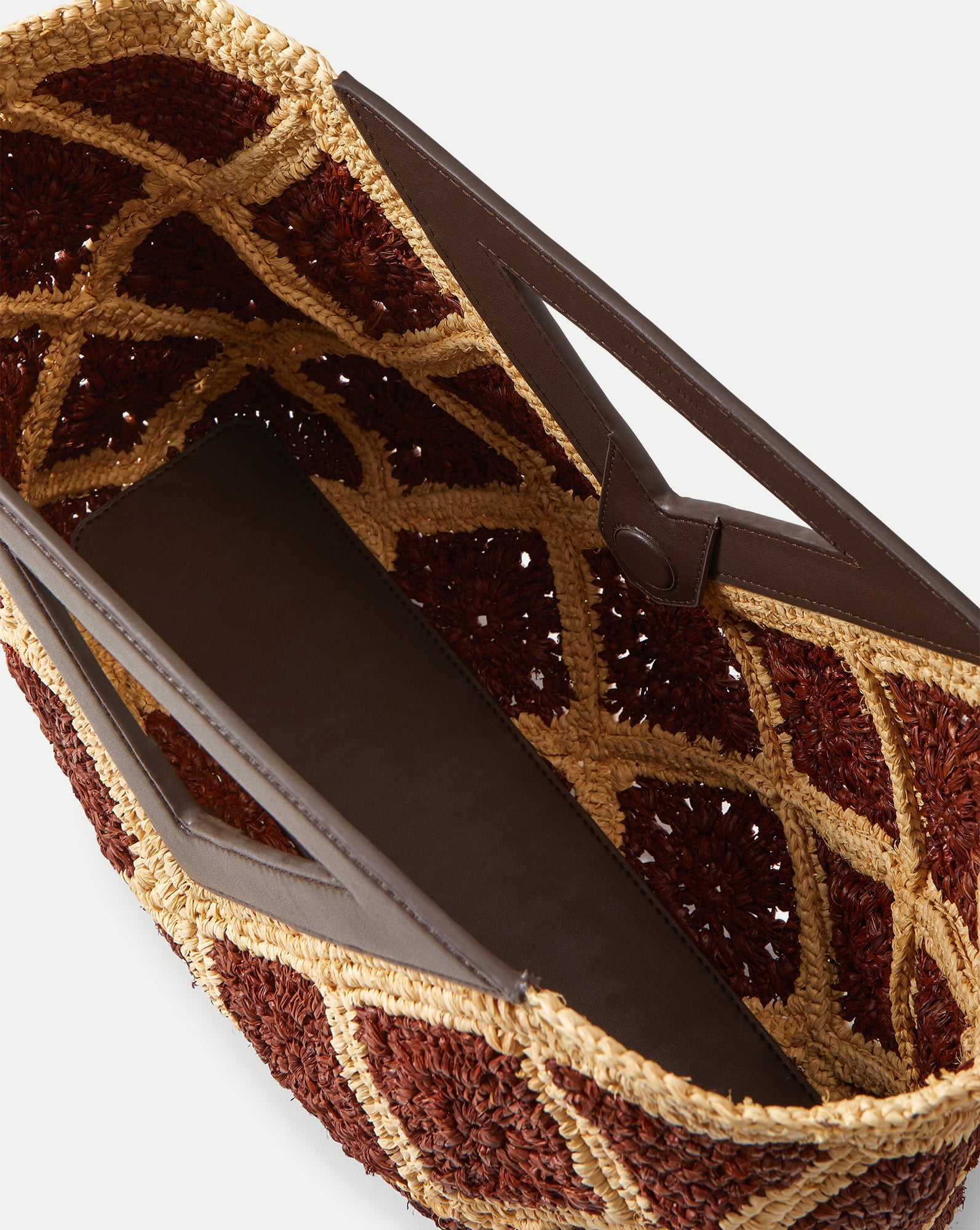 Veronica Beard Brown and tan woven raffia tote bag with dark brown leather trim and handles.