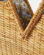 Veronica Beard Woven straw tote bag with a light blue floral patterned fabric lining.