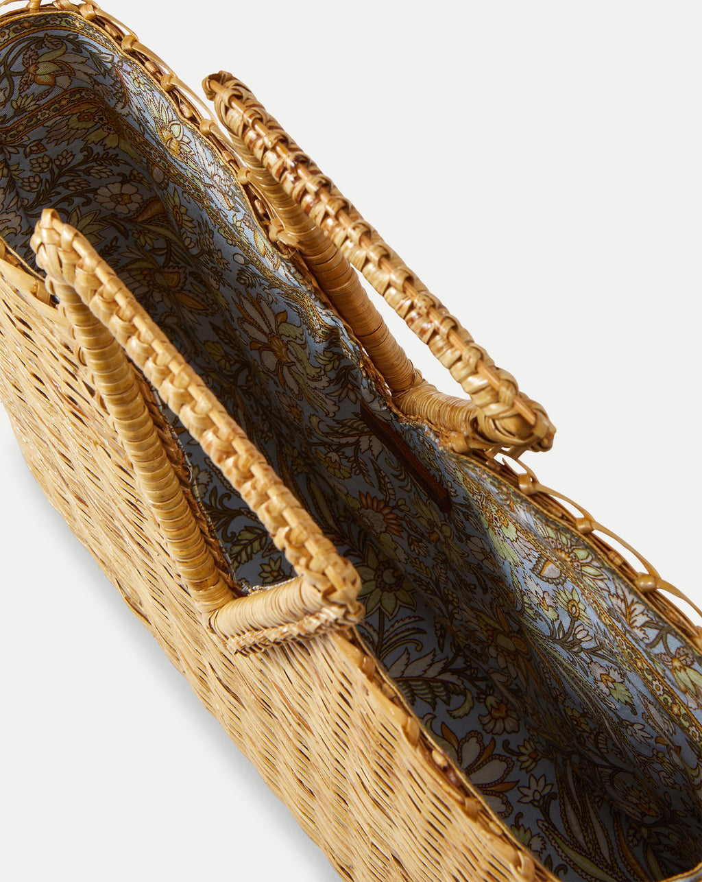 Veronica Beard Woven straw tote bag with braided handles and a light blue floral-patterned fabric lining.