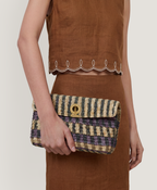 Veronica Beard Striped woven clutch with a gold clasp.