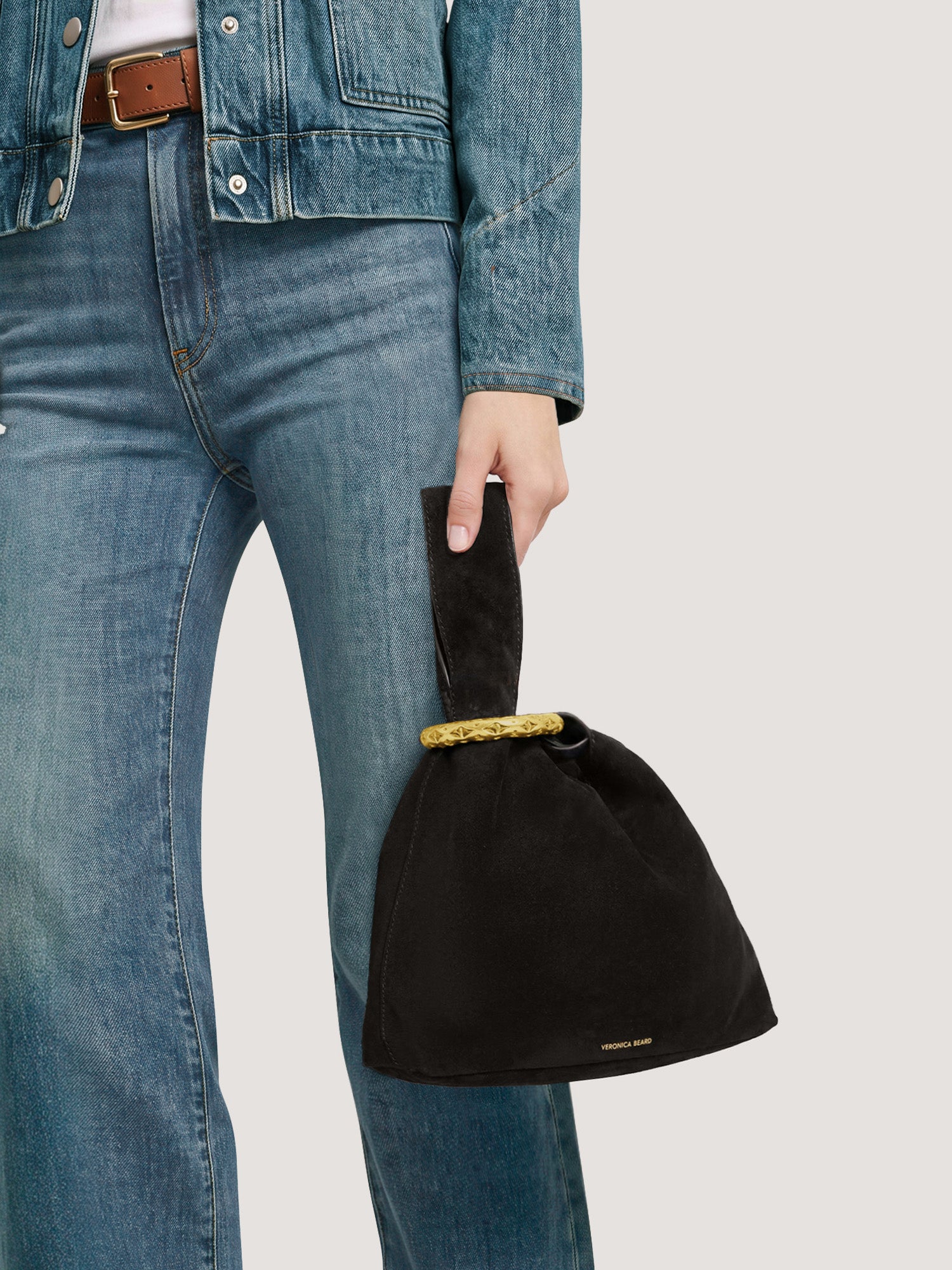 Veronica Beard Black suede knot bag with gold ring handle.