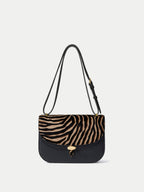 Veronica Beard Black leather and zebra print calf hair shoulder bag.