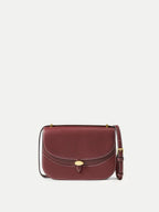 Veronica Beard Burgundy leather saddle bag with gold clasp.