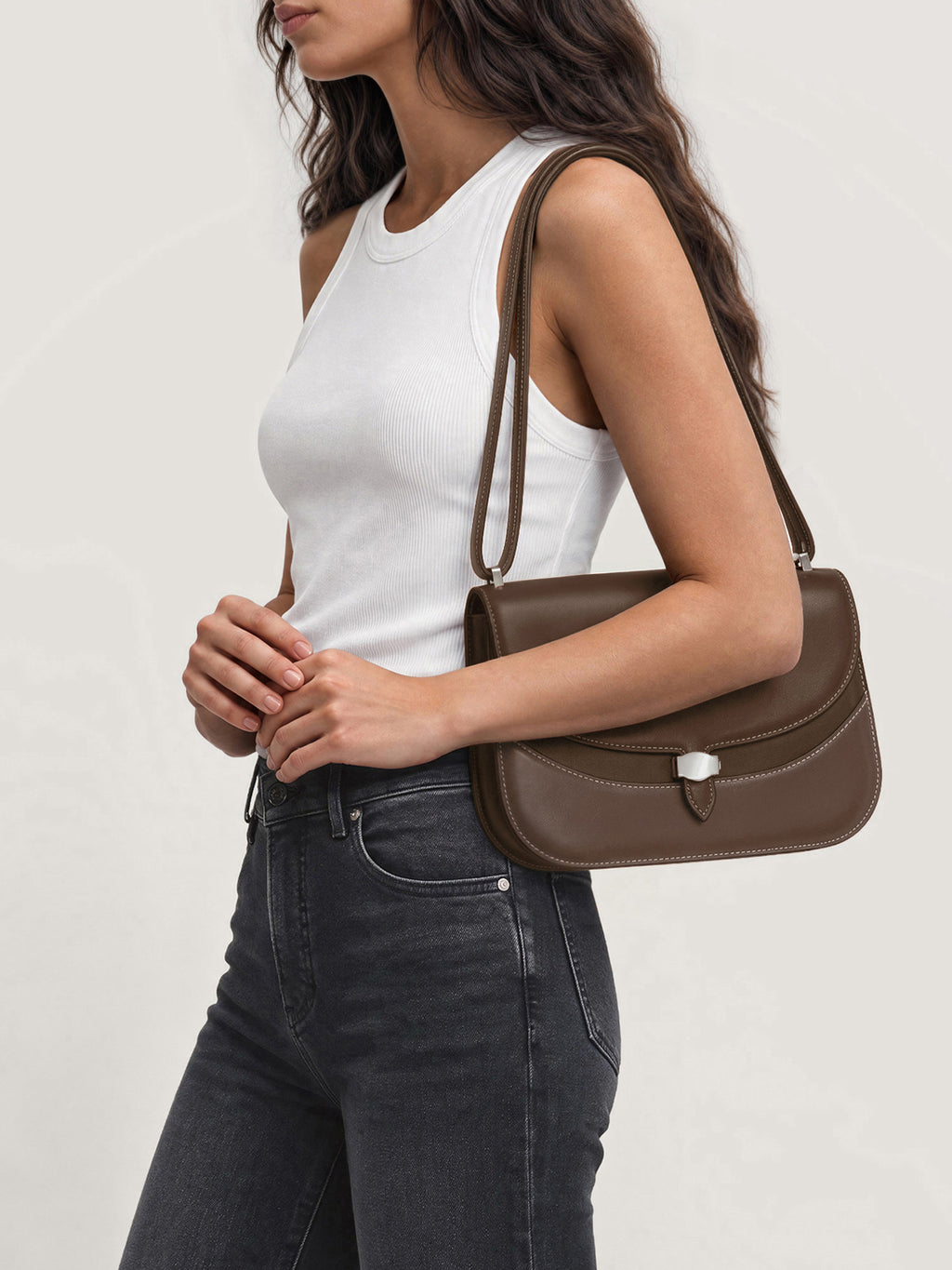 Veronica Beard Brown leather shoulder bag with white stitching.