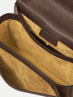 Veronica Beard Brown leather handbag with yellow suede interior compartments.