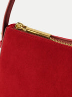 Veronica Beard Red suede shoulder bag with gold zipper.