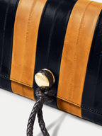 Veronica Beard Black and yellow striped textured leather handbag with closure.