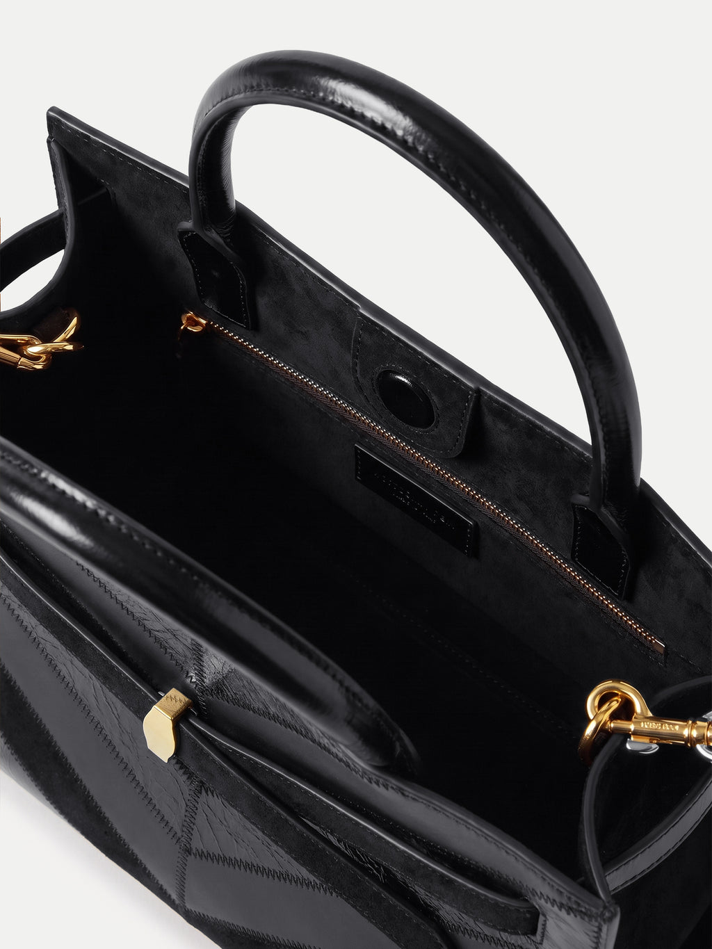 Veronica Beard Black leather structured top-handle handbag with gold hardware.