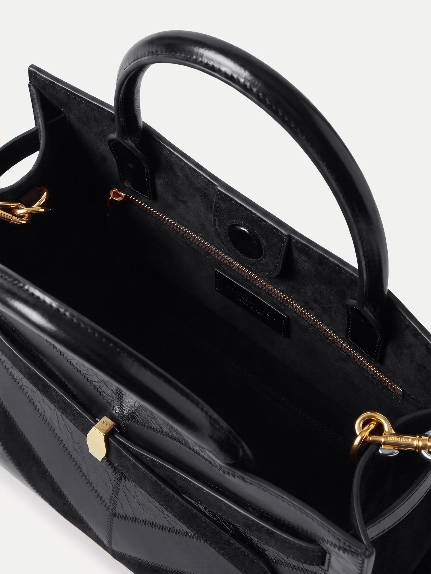 Veronica Beard Black leather structured top-handle handbag with gold hardware.