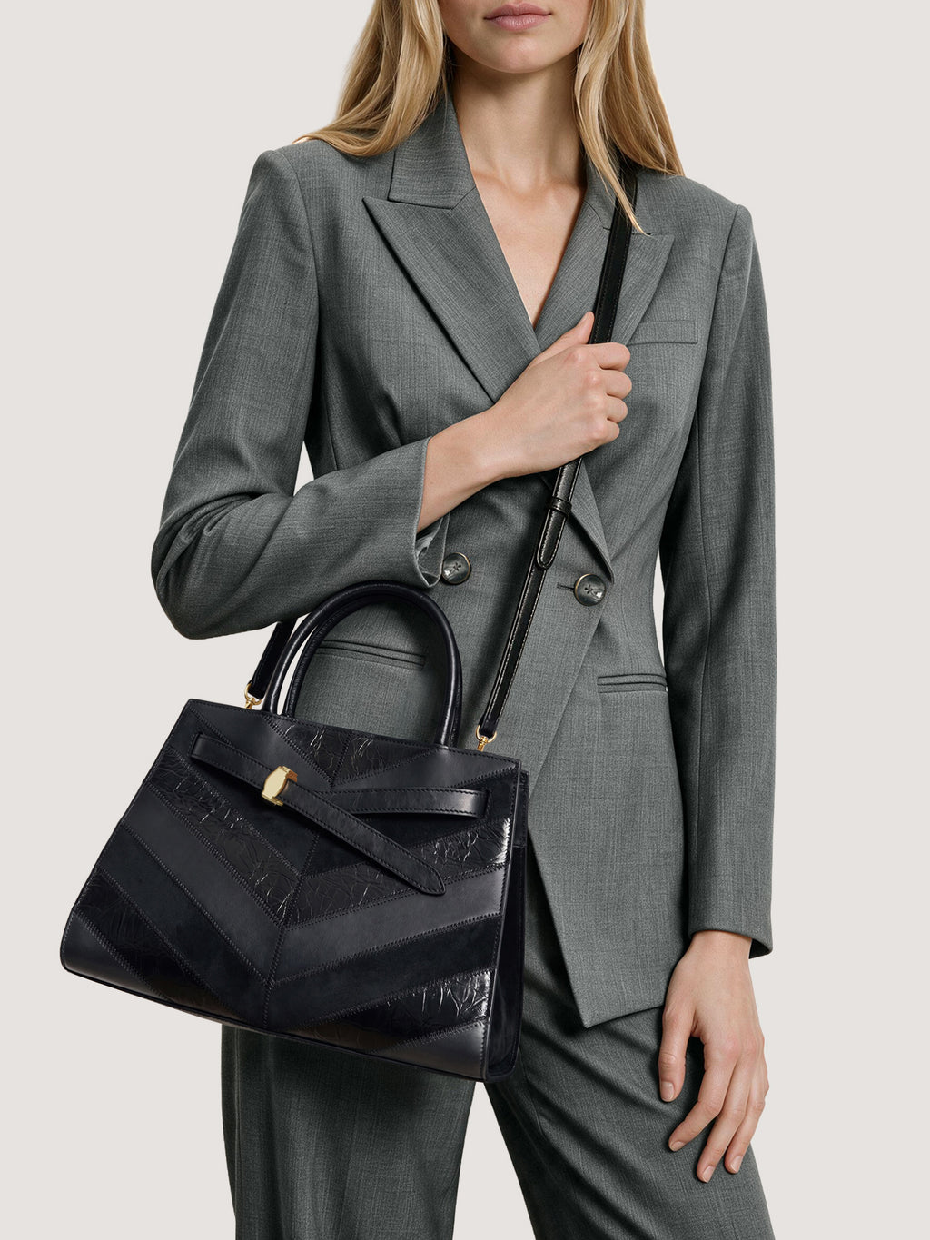 Veronica Beard Black leather structured handbag with chevron patterned panels.