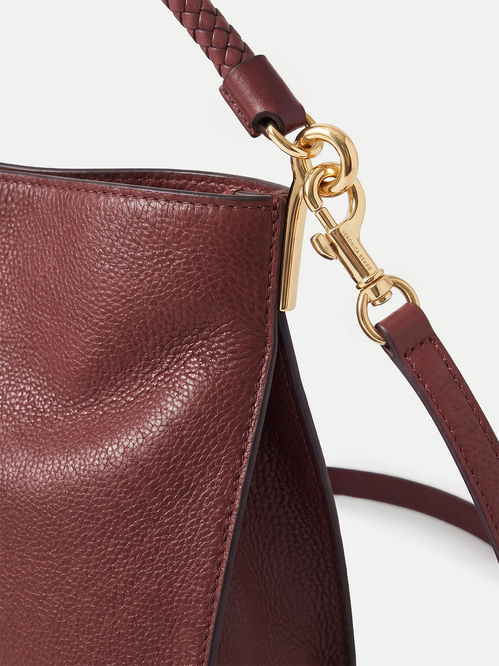 Veronica Beard Maroon leather handbag with gold-tone hardware.