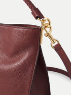 Veronica Beard Maroon leather handbag with gold-tone hardware.