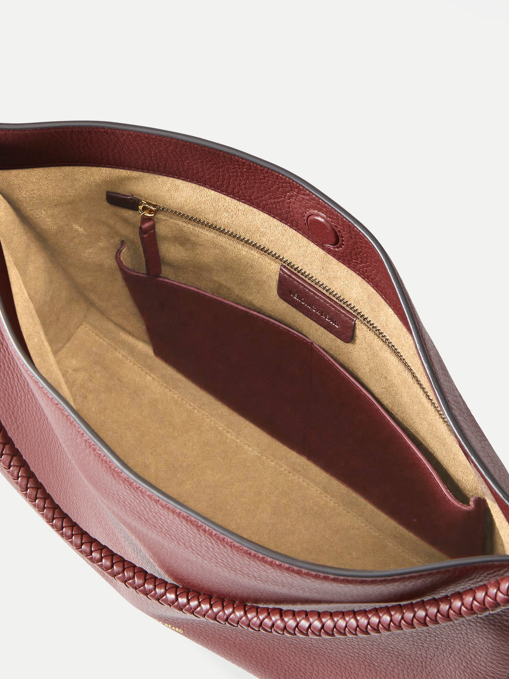 Veronica Beard Maroon leather shoulder bag with braided strap.
