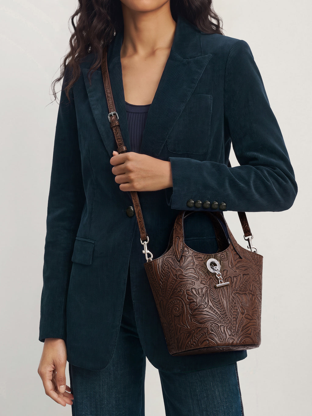 Veronica Beard Dark green corduroy blazer and brown embossed handbag.