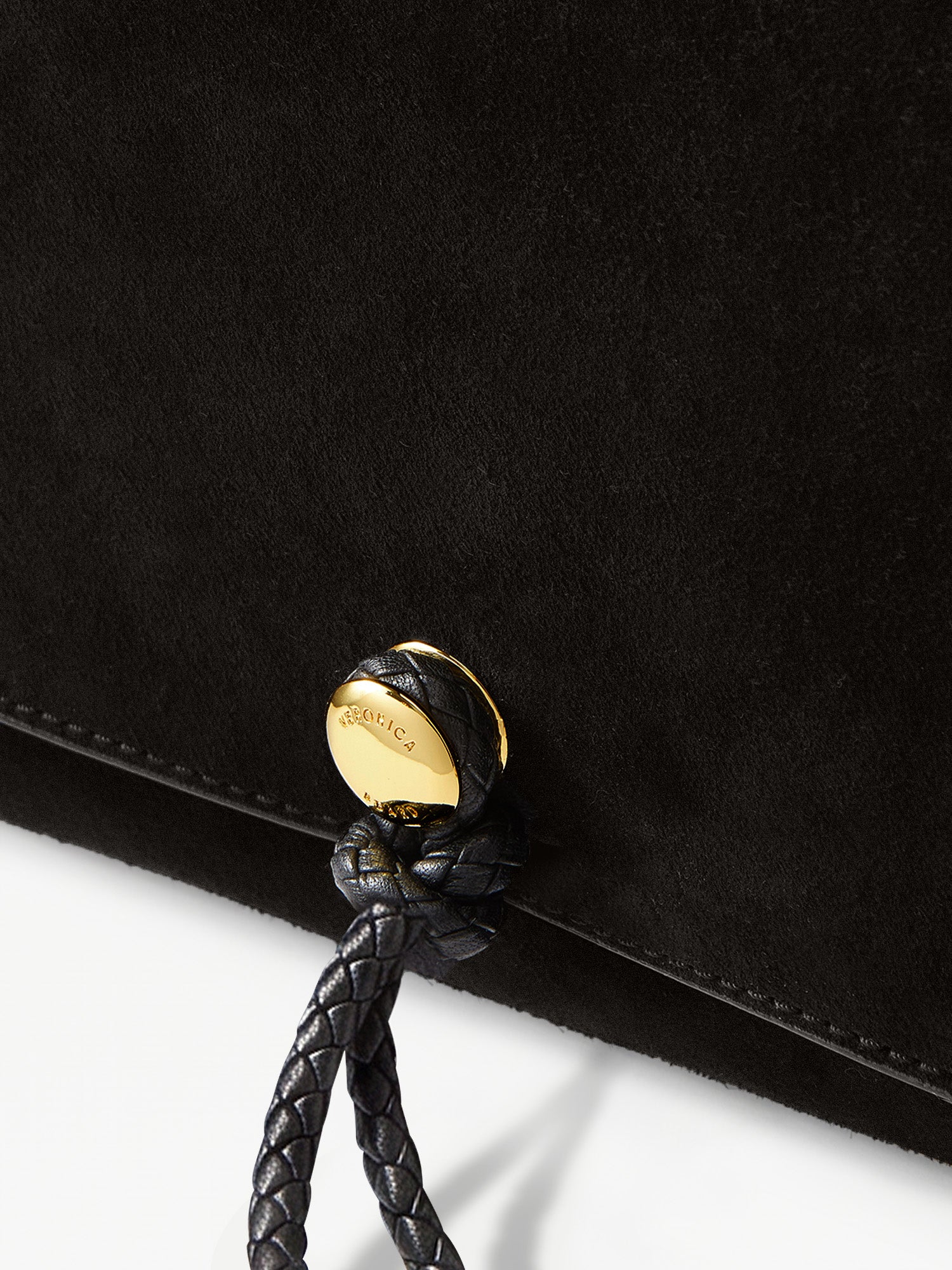 Veronica Beard Black suede bag with gold hardware detail.