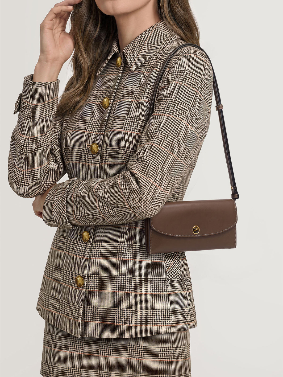 Veronica Beard Brown leather shoulder bag with gold clasp.