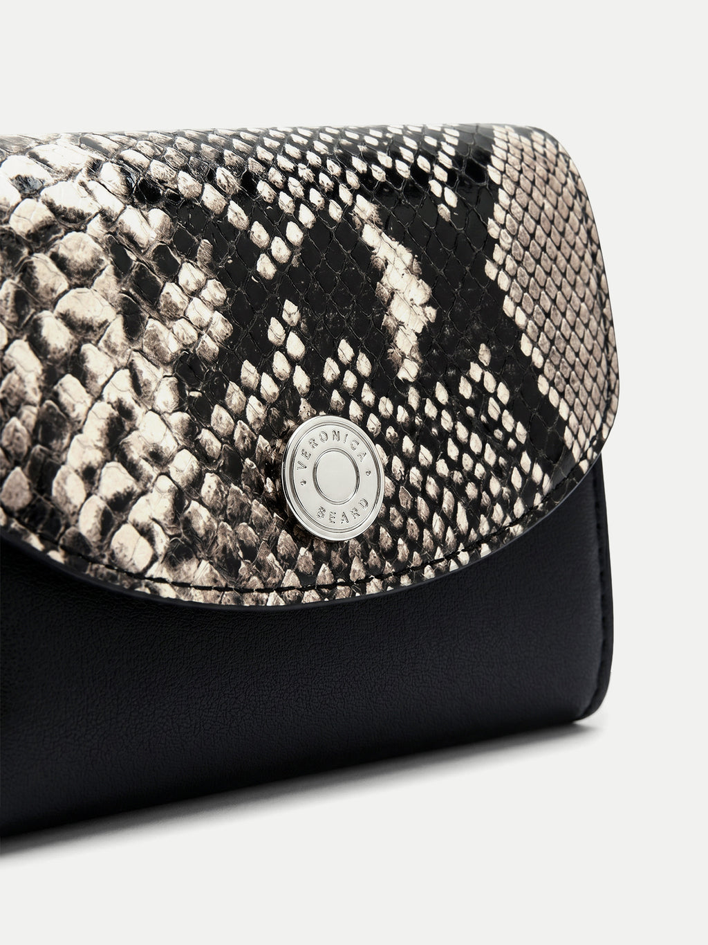 Veronica Beard Black and white snakeskin print wallet with silver button.