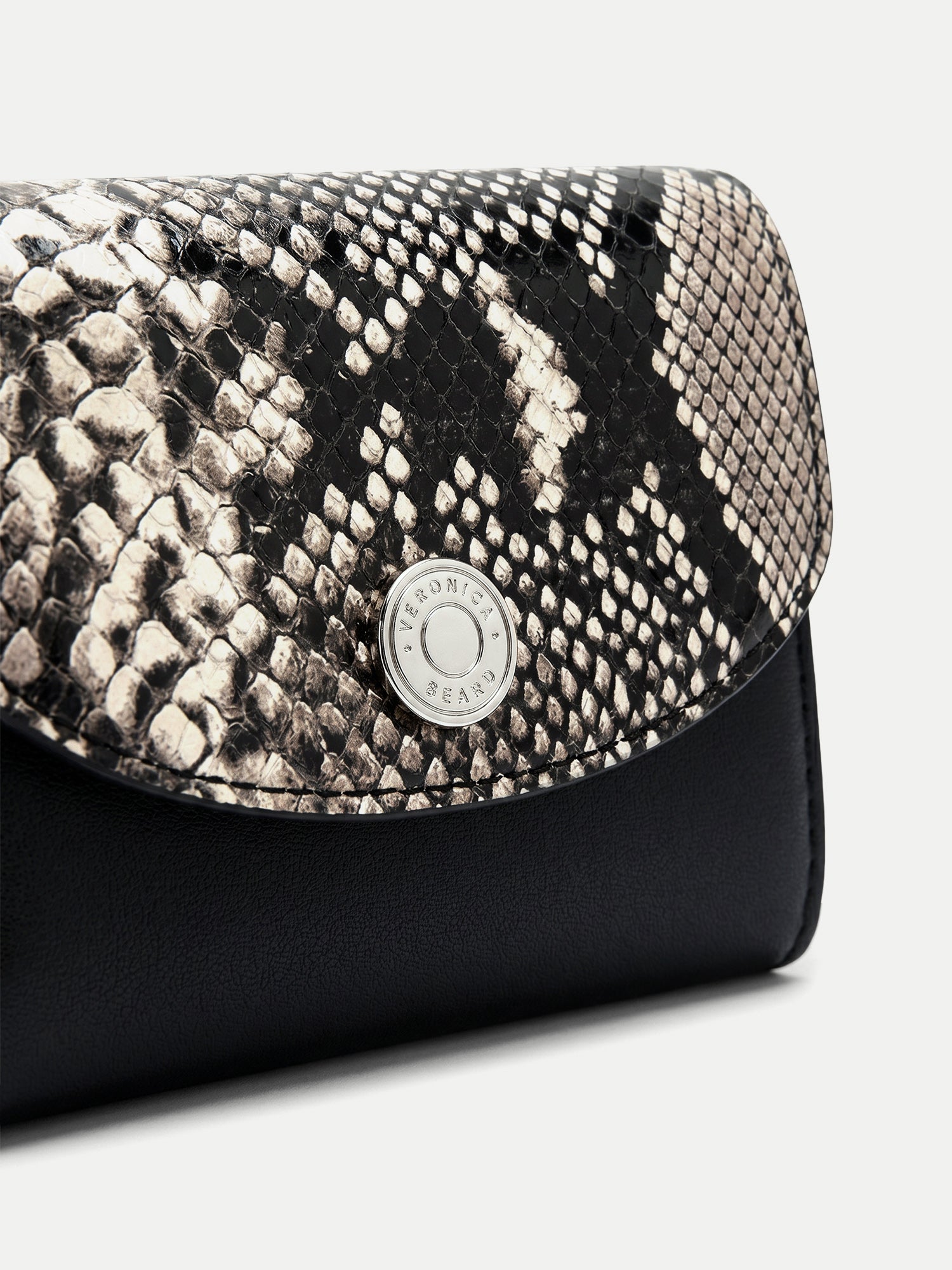 Veronica Beard Black and white snakeskin print wallet with silver button.