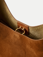 Veronica Beard Brown suede shoulder bag with gold ring detail.