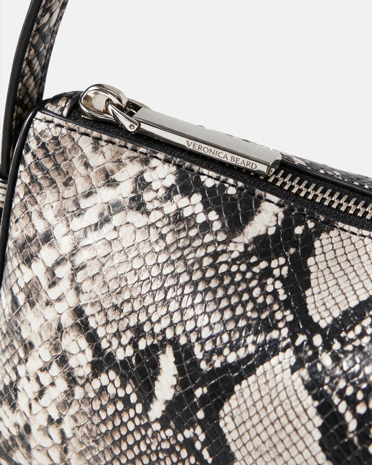 Veronica Beard Black and white snakeskin handbag zipper detail.
