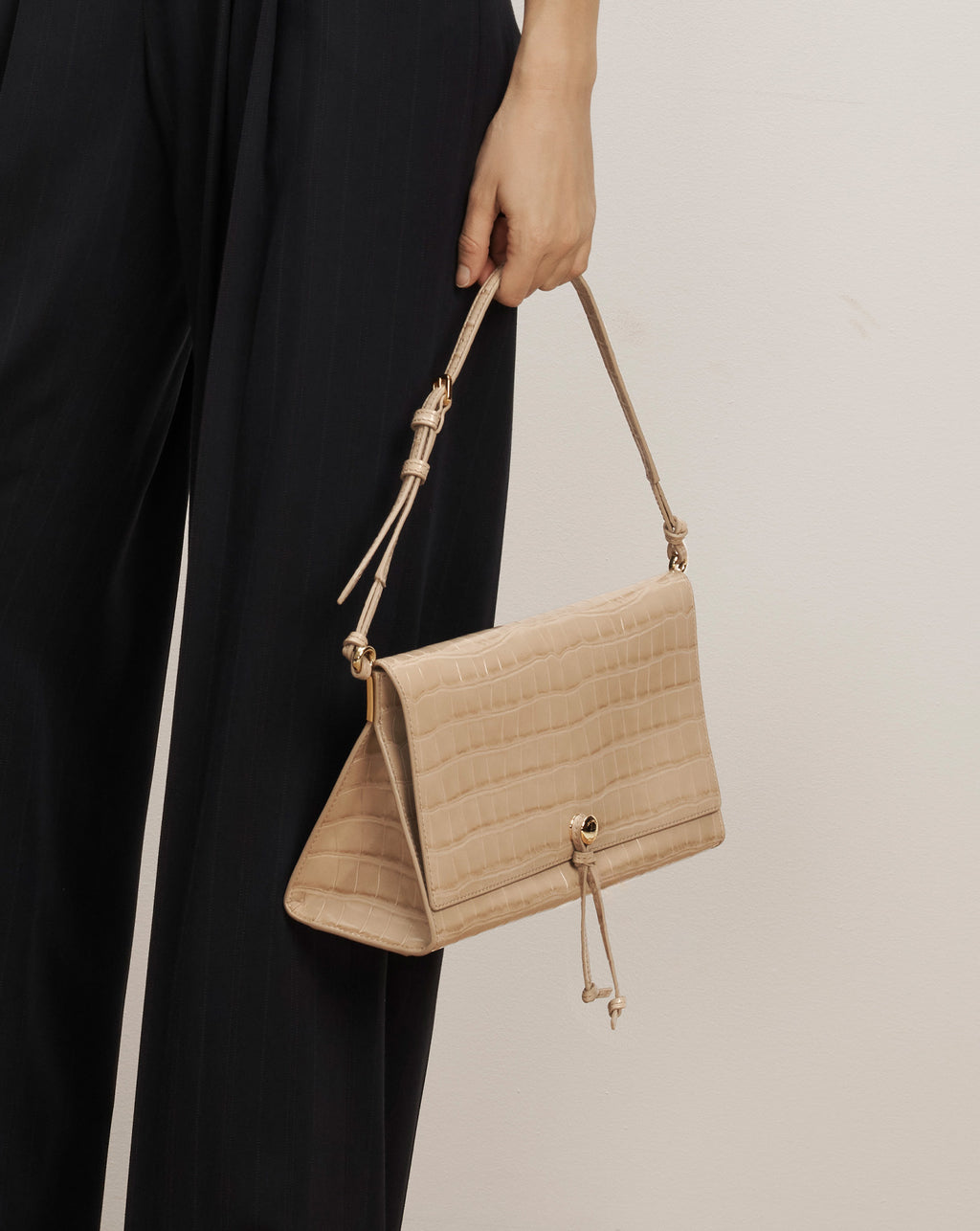 Veronica Beard Beige embossed leather shoulder bag with drawstring closure.
