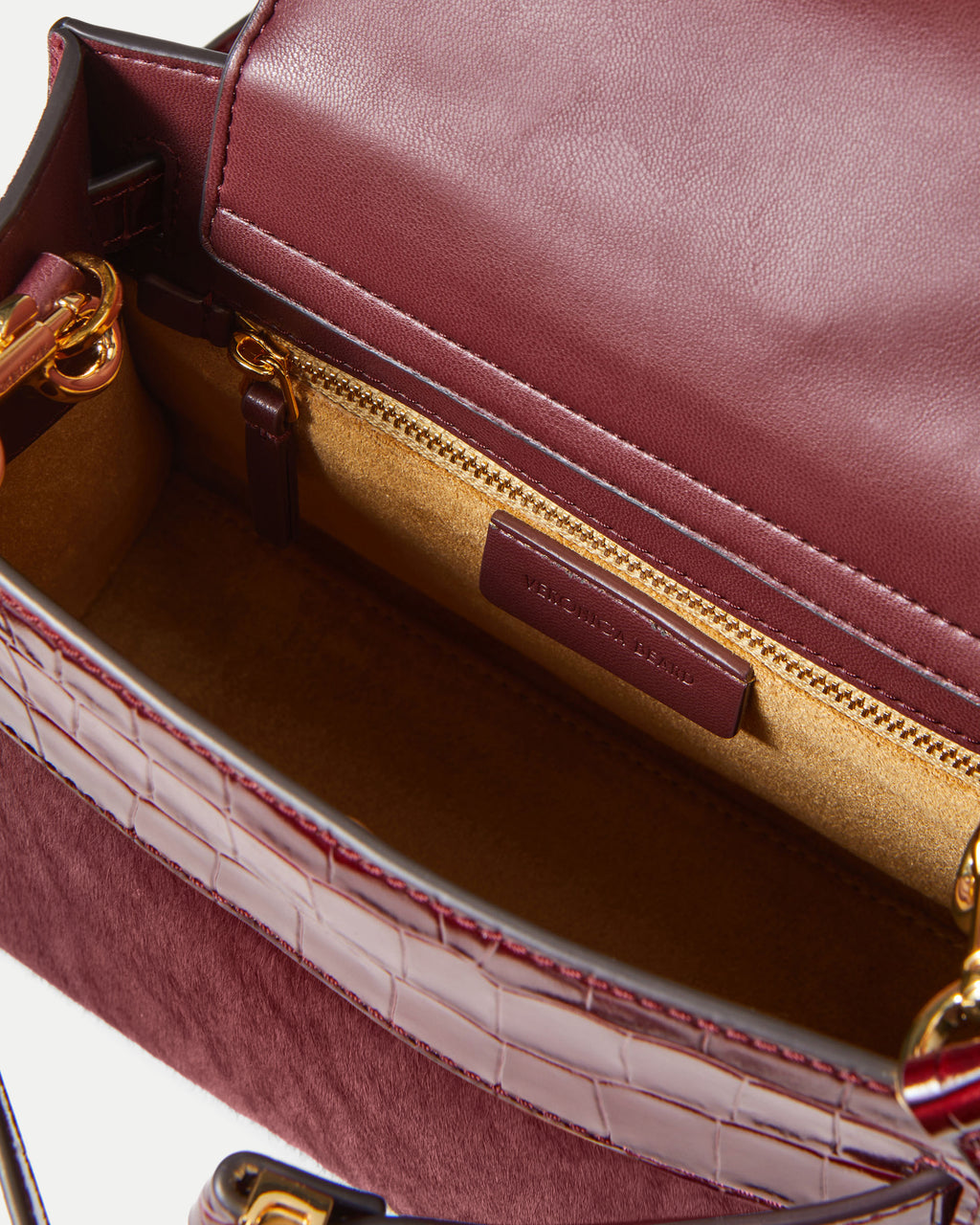 Veronica Beard Maroon leather structured handbag interior.