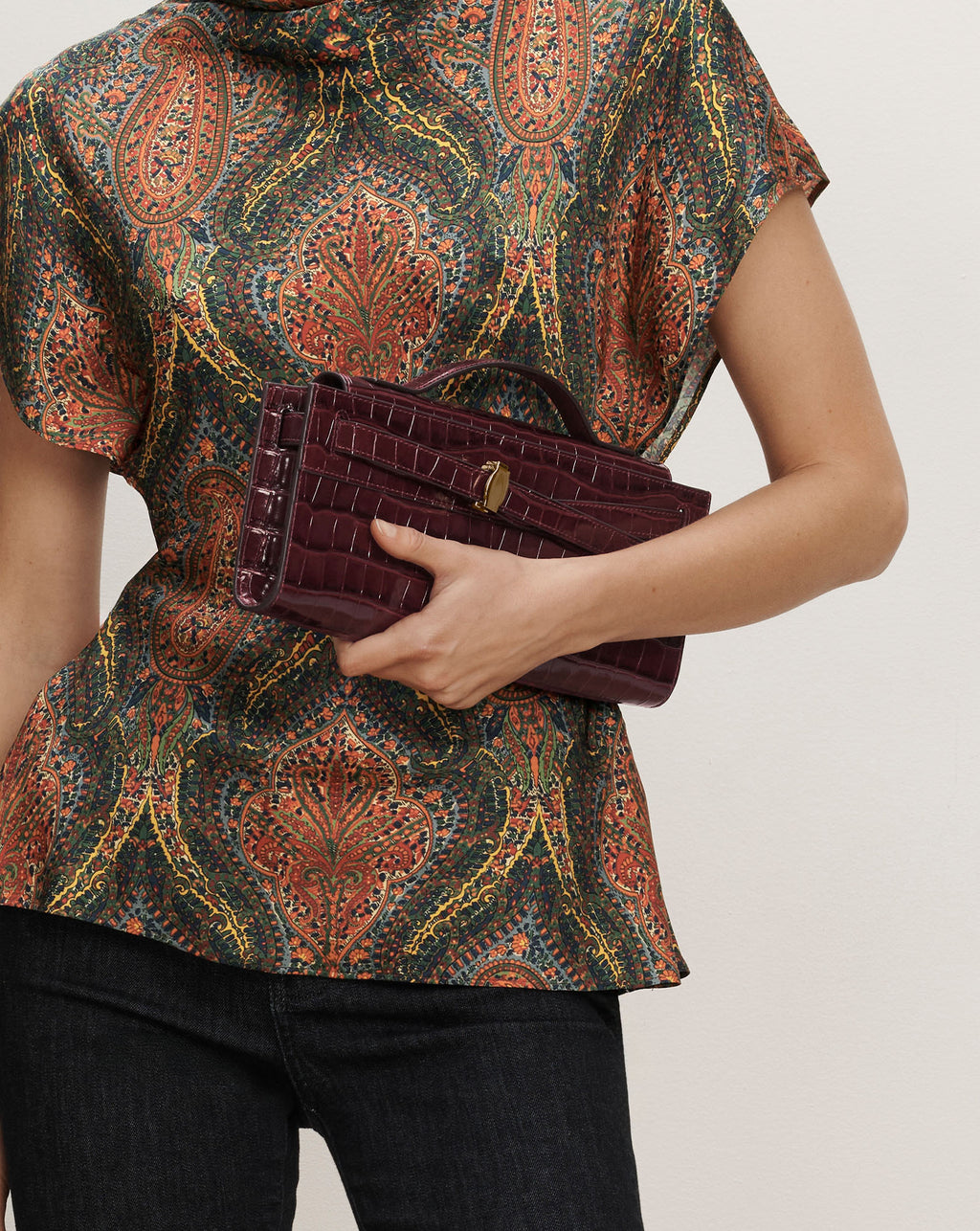 Veronica Beard Burgundy crocodile-embossed leather structured top-handle handbag.