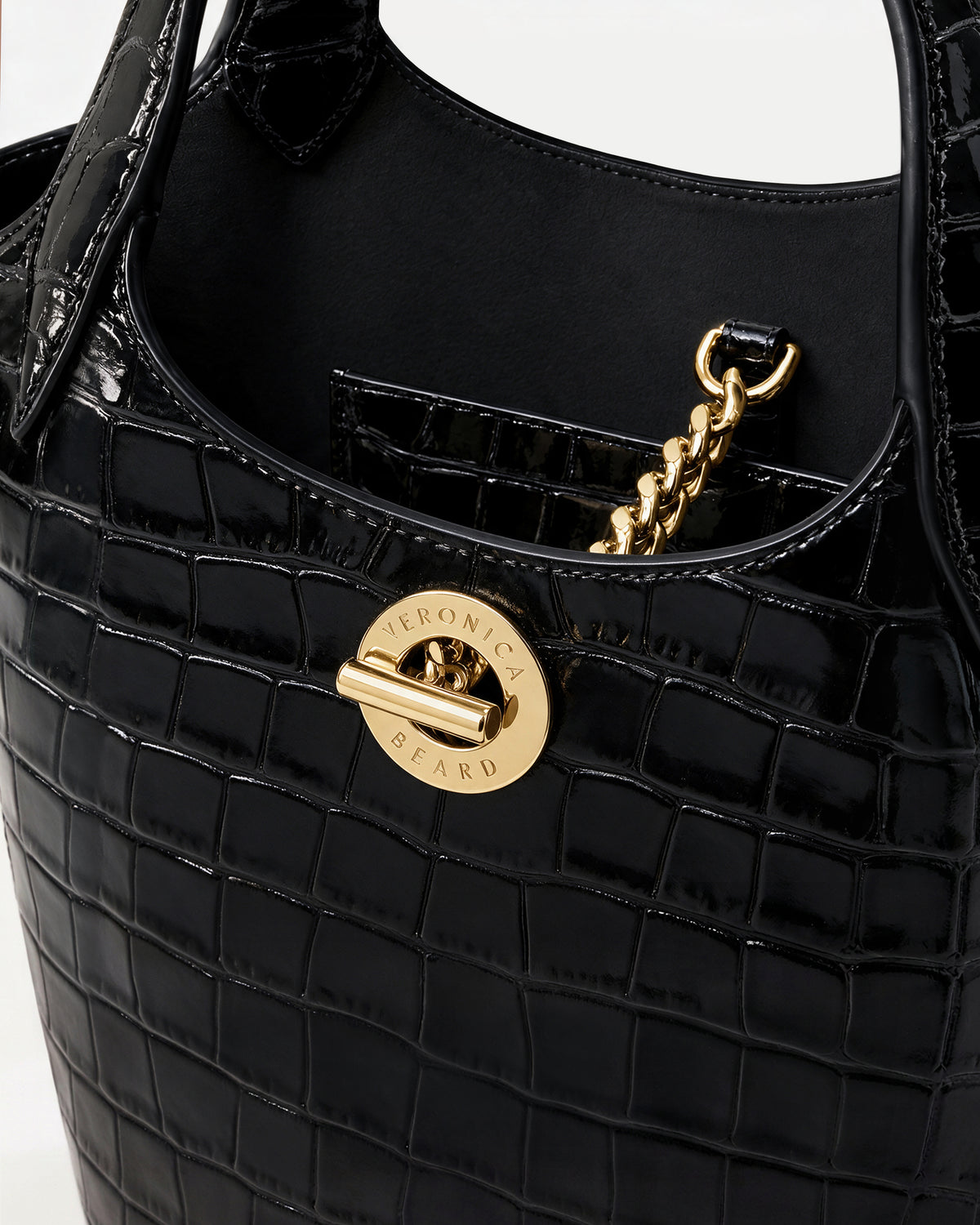 Veronica Beard Black embossed leather handbag with gold-tone hardware.