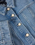 Veronica Beard Light wash denim short-sleeve button-up shirt and matching mini skirt.