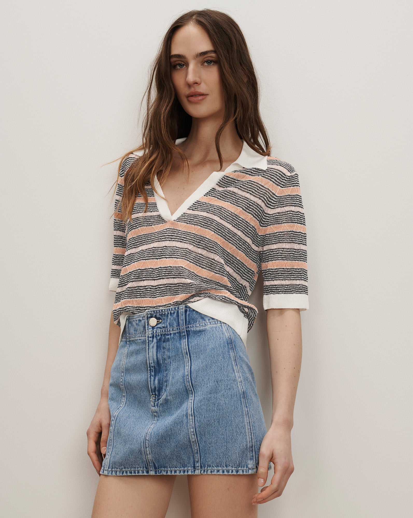 Veronica Beard Striped knit polo shirt with white collar and light wash denim mini skirt.