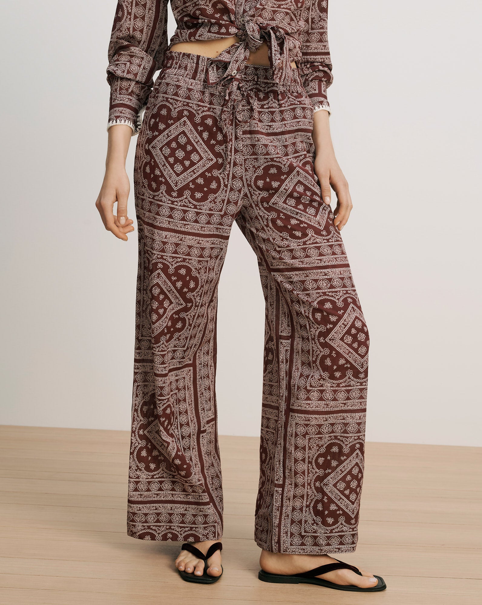 Veronica Beard Brown patterned wide-leg pants with drawstring waist.