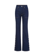 Veronica Beard Dark blue flared jeans with side button details.