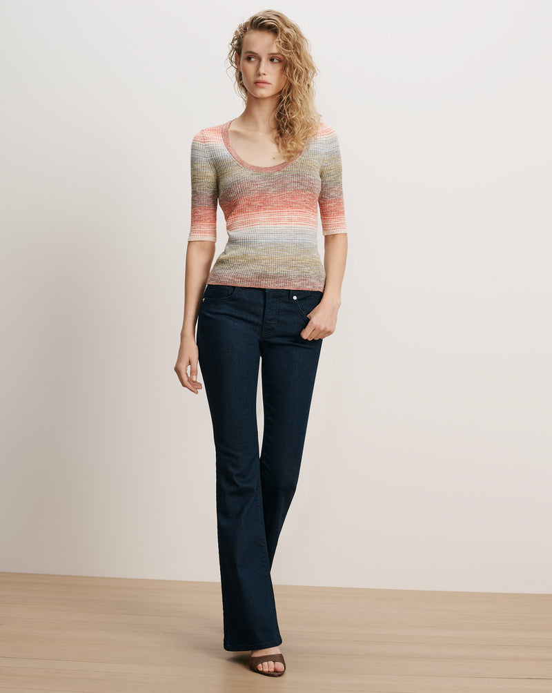 Veronica Beard Striped knit top and dark wash flare jeans.