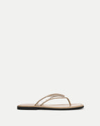 Veronica Beard Beige flat thong sandals with clear vinyl straps.