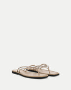 Veronica Beard Beige leather flat sandals with thin straps.