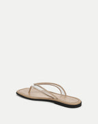 Veronica Beard Beige flat thong sandals with clear vinyl straps and a black sole.