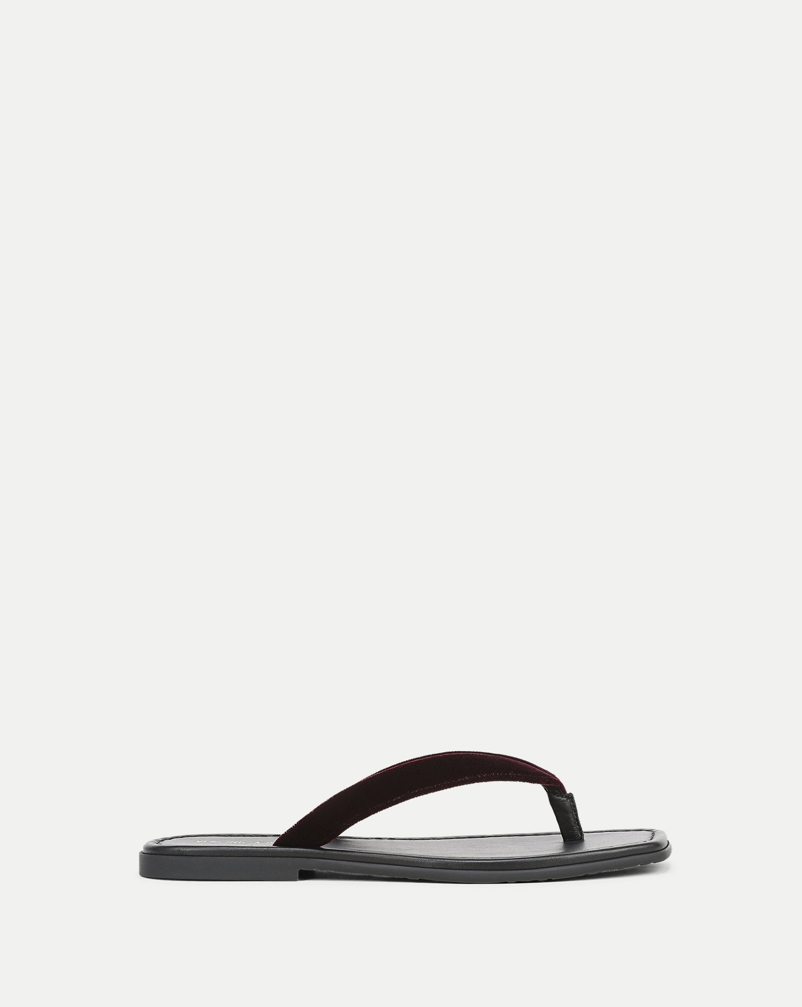 Veronica Beard Black leather sandal with a dark red velvet strap.