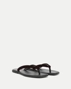 Veronica Beard Black leather sandal with a dark red velvet strap.