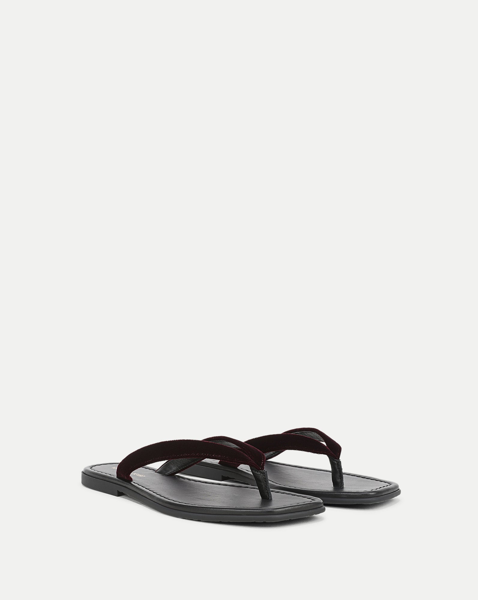 Veronica Beard Black leather sandal with a dark red velvet strap.