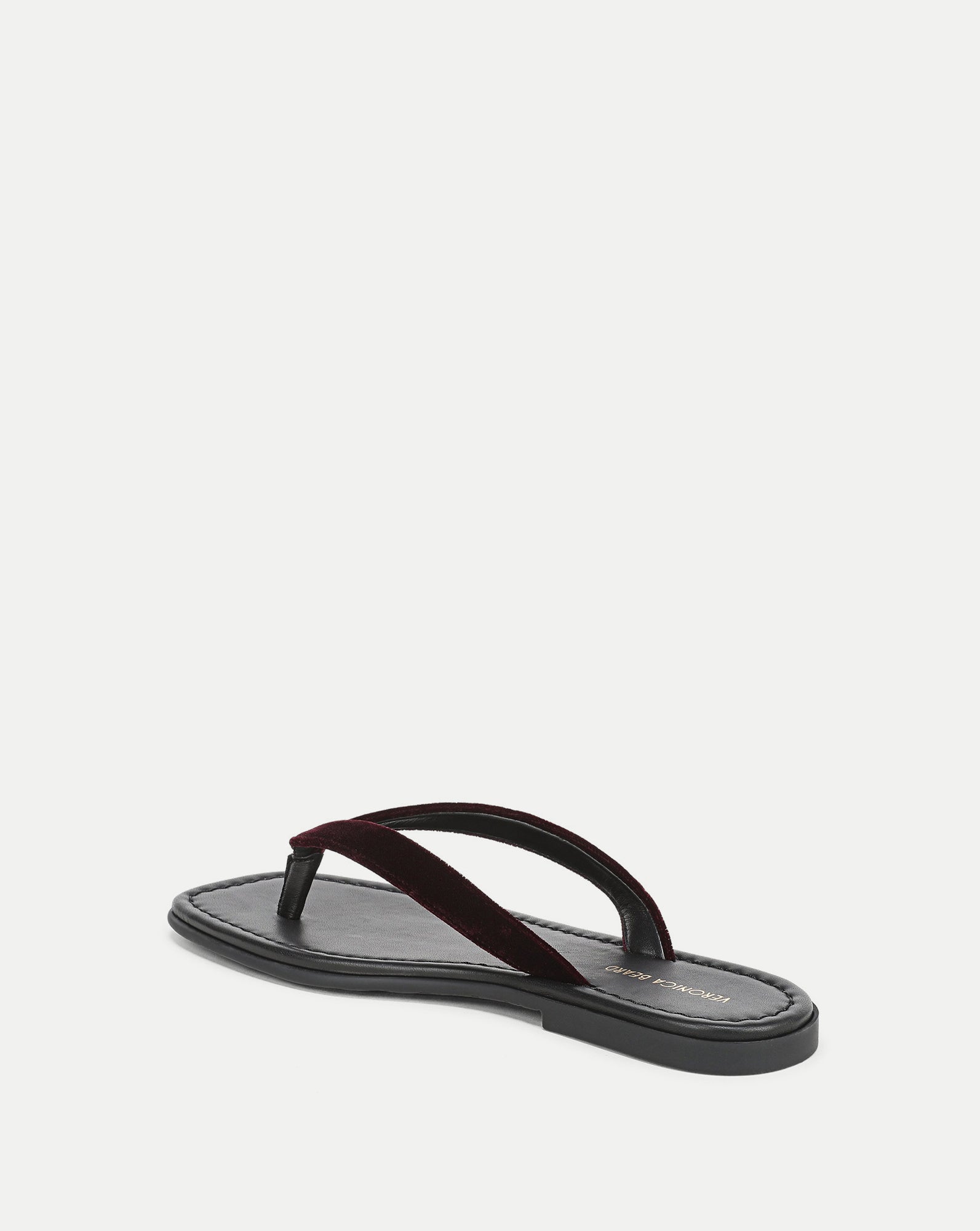 Veronica Beard Black leather sandal with a dark red velvet strap.
